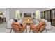 Stylish living room with two sofas, leather chairs, a coffee table, and a view of the TV at 6725 Sw 131St Cir, Ocala, FL 34481