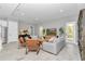 Bright and airy living room with modern furnishings, neutral color scheme, and a large window at 6725 Sw 131St Cir, Ocala, FL 34481