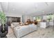Open-concept living area with modern decor, comfortable seating, and natural light perfect for relaxation and entertaining at 6725 Sw 131St Cir, Ocala, FL 34481