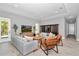 Spacious living room features stylish furnishings, hardwood floors, and ample natural light creating a comfortable space at 6725 Sw 131St Cir, Ocala, FL 34481