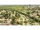 An aerial view of homes nestled in a lush, green neighborhood with mature trees at 819 Haulover Dr, Altamonte Springs, FL 32714