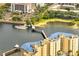 Aerial view of a lake with condos featuring pedestrian bridges and docks for boating at 819 Haulover Dr, Altamonte Springs, FL 32714