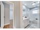 Bright bathroom features a shower over tub, white vanity, and tile floors at 819 Haulover Dr, Altamonte Springs, FL 32714