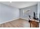 Cozy bedroom with natural light, wood-look floors, and simple, modern decor at 819 Haulover Dr, Altamonte Springs, FL 32714
