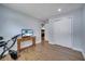 Comfortable bedroom with wood-look floors, TV on table, and closet with sliding door at 819 Haulover Dr, Altamonte Springs, FL 32714