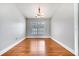 Bright dining room with hardwood floors, modern light fixture, and neutral paint at 819 Haulover Dr, Altamonte Springs, FL 32714