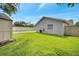 View of house featuring well-maintained lawn, fenced in backyard, and swimming pool at 819 Haulover Dr, Altamonte Springs, FL 32714