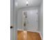 Welcoming foyer with hardwood floors, a textured glass sidelight, and neutral paint at 819 Haulover Dr, Altamonte Springs, FL 32714