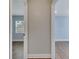 Hallway view into two bedrooms with wood-look floors and natural lighting at 819 Haulover Dr, Altamonte Springs, FL 32714