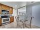 Modern kitchen features a breakfast nook, tile backsplash, and stainless steel appliances at 819 Haulover Dr, Altamonte Springs, FL 32714