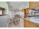 Eat-in kitchen featuring a glass table, granite counters, and stainless steel appliances at 819 Haulover Dr, Altamonte Springs, FL 32714