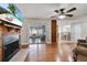 Bright living room features a fireplace, sliding doors to the patio, and an adjacent dining area at 819 Haulover Dr, Altamonte Springs, FL 32714