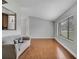 Bright living room featuring hardwood floors, neutral walls, and a large window at 819 Haulover Dr, Altamonte Springs, FL 32714
