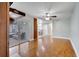 Open-concept living room with a fireplace, sliding doors to the patio, and dining area at 819 Haulover Dr, Altamonte Springs, FL 32714