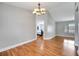 Spacious living room with hardwood floors and view to the bedroom at 819 Haulover Dr, Altamonte Springs, FL 32714