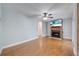 Bright living room with a fireplace and a ceiling fan at 819 Haulover Dr, Altamonte Springs, FL 32714