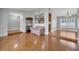 Open-concept living space with hardwood floors and seamless flow into the dining area at 819 Haulover Dr, Altamonte Springs, FL 32714