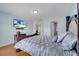 Stylish bedroom with hardwood floors and a mounted TV at 819 Haulover Dr, Altamonte Springs, FL 32714