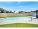 Backyard pool with a paved patio area, surrounded by lush green grass and a privacy fence at 819 Haulover Dr, Altamonte Springs, FL 32714