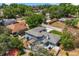Aerial view showcases the home's backyard deck, landscaping, and neighborhood at 955 Seminole St, Clermont, FL 34711