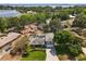 Aerial view of the home showcasing its well-manicured lawn, landscaping, and neighborhood at 955 Seminole St, Clermont, FL 34711