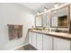 Modern bathroom featuring a double sink vanity, framed mirrors and decorative hardware at 955 Seminole St, Clermont, FL 34711