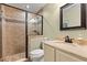 Tastefully designed bathroom with tiled shower, modern fixtures, and neutral color palette at 955 Seminole St, Clermont, FL 34711