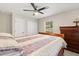 Comfortable bedroom featuring a ceiling fan, window, and a cozy bed at 955 Seminole St, Clermont, FL 34711