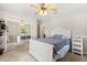 Comfortable bedroom with mirrored closet, ceiling fan, and neutral decor at 955 Seminole St, Clermont, FL 34711