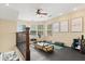 Bright bonus room with exercise equipment, natural light, and neutral tones provides a comfortable atmosphere at 955 Seminole St, Clermont, FL 34711