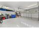 Spacious garage with epoxy flooring, storage shelves, and ample room for vehicles and equipment at 955 Seminole St, Clermont, FL 34711