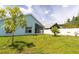 Backyard view with verdant lawn and privacy fence surrounding the house at 11547 Grazeley Ct, Orlando, FL 32837