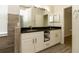 Bathroom features double sinks, granite countertops, and wood-look tile at 11547 Grazeley Ct, Orlando, FL 32837