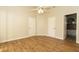 Spacious bedroom featuring wood-look flooring and an ensuite bathroom at 11547 Grazeley Ct, Orlando, FL 32837