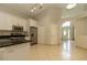 Bright kitchen with stainless steel appliances, granite countertops, and tile flooring at 11547 Grazeley Ct, Orlando, FL 32837