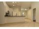 Bright kitchen showcasing modern appliances, sleek countertops, and access to the living area at 11547 Grazeley Ct, Orlando, FL 32837