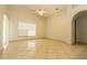 Spacious living area boasting high ceilings, tile floors, and natural light from the windows at 11547 Grazeley Ct, Orlando, FL 32837