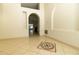 Open-concept living area with tile flooring, neutral walls, and an eye-catching mosaic accent at 11547 Grazeley Ct, Orlando, FL 32837