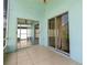 The property has a covered patio with sliding doors, tile flooring, and outdoor space at 11547 Grazeley Ct, Orlando, FL 32837