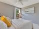 Bright bedroom featuring a comfortable queen bed, and stylish coastal-themed decor at 12636 Hammock Pointe Cir, Clermont, FL 34711