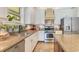 A well-appointed kitchen featuring stainless appliances and granite countertops at 12636 Hammock Pointe Cir, Clermont, FL 34711
