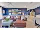 Comfortable living room boasts stylish decor, plush seating, and ample natural light at 12636 Hammock Pointe Cir, Clermont, FL 34711
