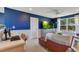 Spacious living area provides comfortable seating, a modern aesthetic, and plenty of natural light at 12636 Hammock Pointe Cir, Clermont, FL 34711