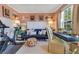 Bright living room area including a sofa, stylish desk, and exercise equipment at 12636 Hammock Pointe Cir, Clermont, FL 34711