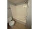 A well-lit bathroom with a toilet and shower at 131 Water Front Way # 110, Altamonte Springs, FL 32701
