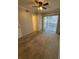 Comfortable bedroom featuring neutral carpet, a ceiling fan, and ample closet space at 131 Water Front Way # 110, Altamonte Springs, FL 32701
