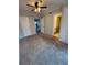 This bedroom has neutral paint, carpet, and a ceiling fan at 131 Water Front Way # 110, Altamonte Springs, FL 32701