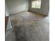 Bright and spacious living room featuring neutral carpet, view from the window, and ample natural light at 131 Water Front Way # 110, Altamonte Springs, FL 32701