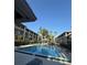 A shared pool at the apartment complex, with multiple lounge chairs available at 131 Water Front Way # 110, Altamonte Springs, FL 32701