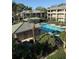Community pool is nestled among lush landscaping with room for grilling and lounging at 131 Water Front Way # 110, Altamonte Springs, FL 32701